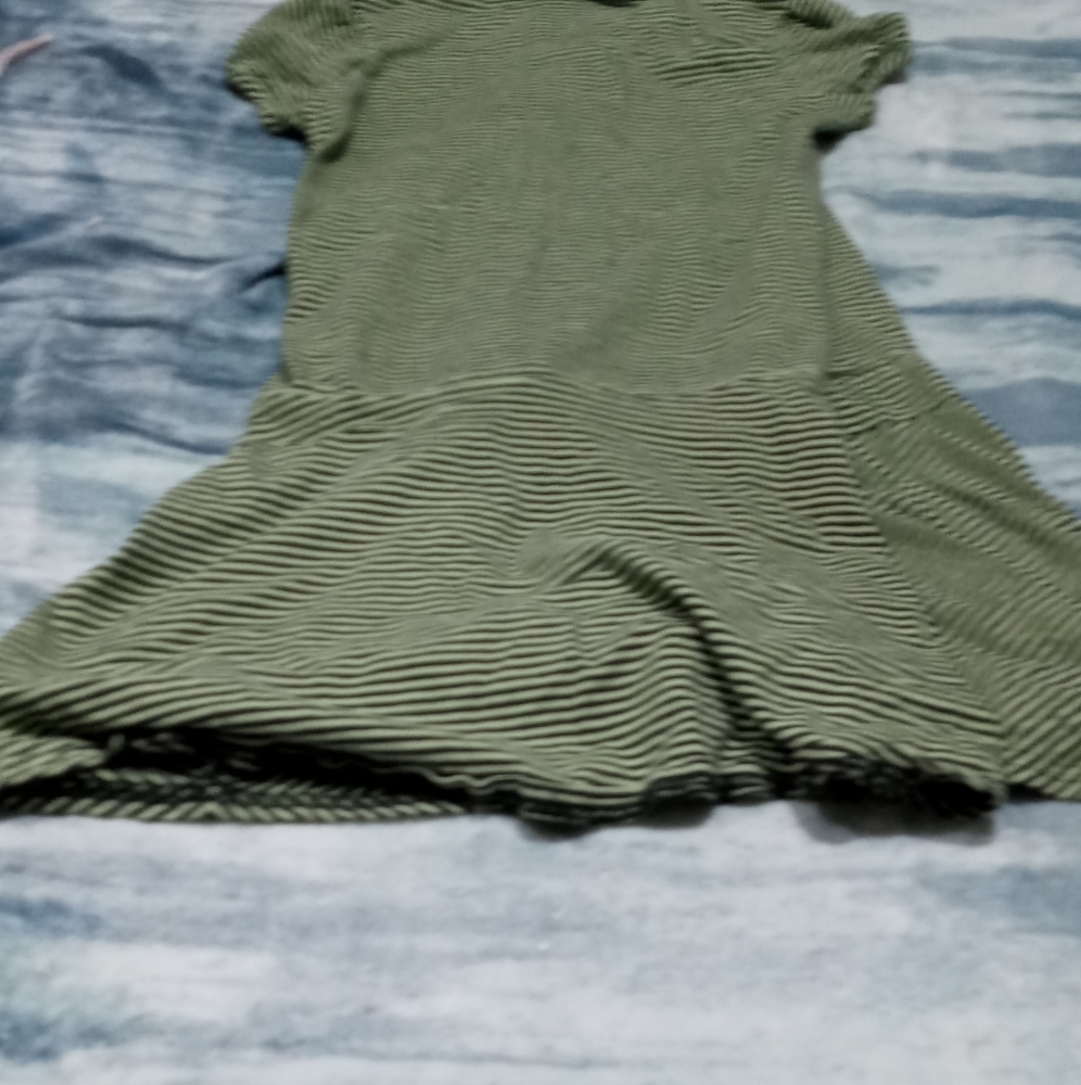 A green and black dress or night gown